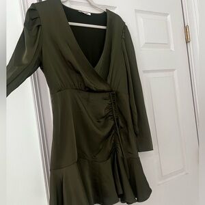 An olive green steve madden dress with scrunch tie in the front, a littl v-neck